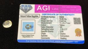 lot 41 image: AGI Labs 10.20 Cts Oval Cut Natural Yellow Sapphire With COA