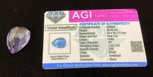 lot 42 image: AGI Labs 30.10 Cts Pear Cut Violet Amethyst With COA
