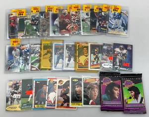 lot 45 image: Misc. Sports Cards In Protective Sleeves & Elvis Unopened Packs