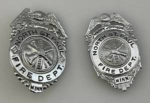 lot 74 image: Vintage North St. Paul Fire Dept. Badges