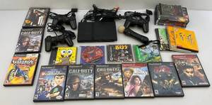 lot 155 image: Playstation 2 With Games & More
