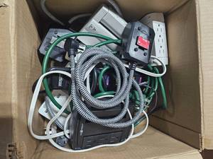 Box of Surge Protectors and Extension Cords