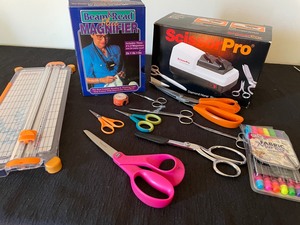 lot 77 image: Scissors Galore Lot with Sharpener, Magnifier & Paper Cutter