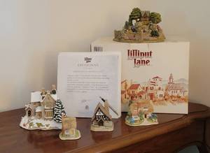 lot 75 image: Leonoras Secret & Olds Victorridge At Christmas Cottages by Lilliput Lane along with 3 Others