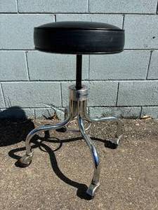 lot 14 image: MSRP $500 High Quality Brewer Stainless Steel Height Adjustable Screw Top Salon Tattoo Dental Workbench Stool Chair - Great Working Condition