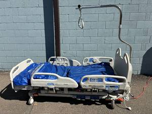 lot 15 image: MSRP $35,000 Hill-Rom P3200&nbspVersaCare Hospital Patient Care Bed WAir Bed Turn Assist Function, Scale, Bed Exit Alarm, Low Chair Function & Rare Hand Remote Control Excellent Working Condition See Youtube