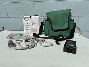 lot 43 image: MSRP $600 Precision Medical Easy Go Vac Aspirator With Carry Bag - Excellent Working Condition