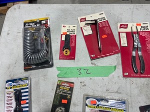 TABLE FULL OF AUTO SPECIALTY TOOLS