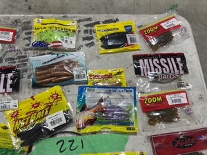 TABLE FULL OF FISHING PLASTICS