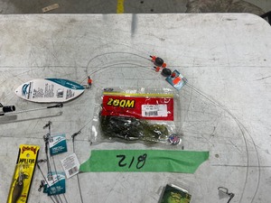 TABLE FULL OF CATFISH LURES, LINE, HOOKS, & ROD
