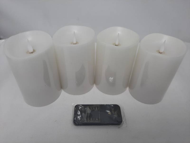 lot 704 image: Illure 4-Pack 5 Inch Lumi360 Battery Operated Candles White w Remote