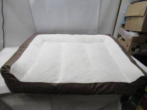 lot 212 image: NEW Kirkland XL Signature Rectangular Bolster 46 x 36 Pet Bed, Brown Faux Leather
