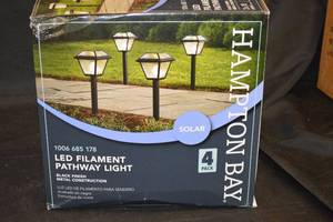 lot 5 image: NEW - Hampton Bay Warrenton 13 Lumens Black LED Outdoor Solar Path Light with Glass Top, Seedy Glass and Vintage Bulb (4-Pack)