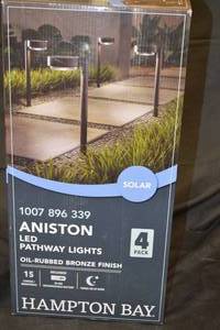lot 54 image: NEW - Hampton Bay Aniston 15 Lumens Solar LED Outdoor Pathway Lights 4-Pack