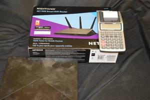 lot 153 image: Nighthawk AC1900 Smart WiFi Router, Sony BluRay Player, Casio Receipt Printing Calculator