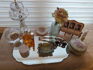 lot 23 image: Dressing Table group 12 Pieces (lamp, mirror, clock, vintage abalone opera glasses, trinket box, lefton container, charlie perfume Mirror)