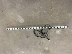 lot 33 image: Tripp-Lite PS6020 20-Outlet Vertical Power Strip - Good Condition - One Socket Has Damage