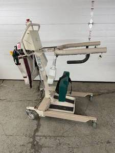 lot 74 image: MSRP $9,000&nbspEZ Way Smart Stand Sit to Stand Patient Lift 400lb Capacity Battery Powered&nbspWRemote, Sling , Battery No Charger Can Be Purchased Online - Has WearTear However Good Working Condition