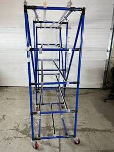 lot 78 image: WOW MSRP $4000 #2 Like New Industrial Modular Material Handling Flow Rack Storage Shelving Unit System Cart With Double Sliding Rolling Tracks On Almost Each Shelf&nbsp Speed Up Operations With This Flow Racking - A Couple Bends On Bottom Pipes