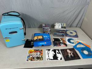 Cds, Mini Fridge, Tom Tom, and More