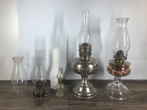 lot 379 image: 4 - Vintage Kerosene Lamps with 3 Extra Globes