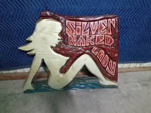 lot 304 image: Carved wood plaque of Silver Naked Lady