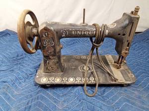 lot 299 image: Vintage Unique brand sewing machine