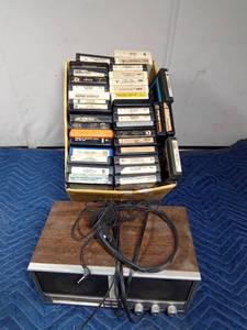 lot 293 image: Double layered box of 8 tracks with 8trackradio player and headphones