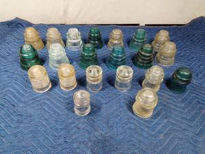 lot 262 image: Green and clear Hemmingway and Pyrex insulators