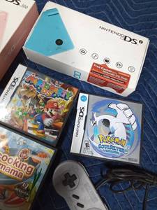 lot 275 image: 3 game controllers and empty DS cases and more