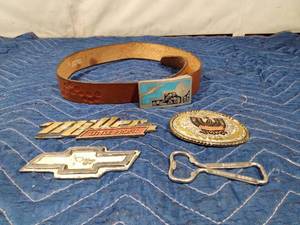 lot 273 image: 2 belt buckles, belt, emblems and Schmidt bottle opener