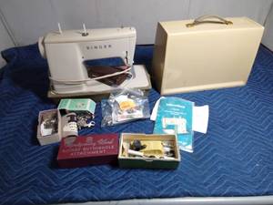 lot 247 image: Singer sewing machine in case with attachments