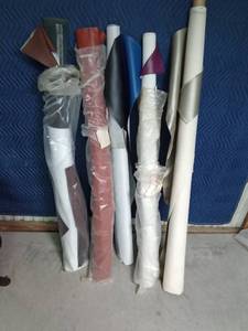 lot 242 image: 5 Partial rolls and pieces of vinyl upholstery material
