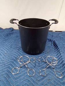lot 83 image: Approximately an 8qt pot and 2 beercan chicken holders