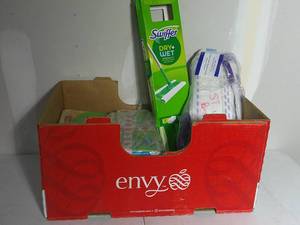 lot 29 image: Apple Box of Swiffer Supplies