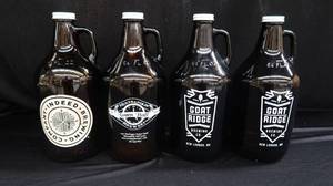 lot 8 image: 4 AMBER GROWLERS