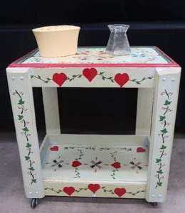 lot 12 image: WOODEN HAND PAINTED CART ON WHEELS WITH FLOWER FROG AND GLASS FLOWER VASE