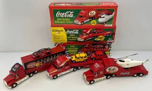 lot 74 image: Misc. COCA-COLA Collectible Semis (NIB) 1Missing Battery Box
