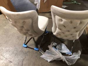 lot 38 image: Ottomanson Royal 20 in. W x 37.5 in. H Leatherette Pearl WhiteSilver Upholstered Dining Side Chair No Assembly Required (Set of 2)  Customer Returns See Pictures
