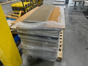 lot 103 image: Pallet of TableTopsCounter Tops various sizes. One is butcher block.