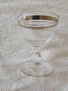 lot 84 image: MCM Silver Banded Champagne Glasses