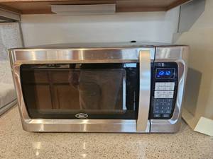 lot 88 image: Oster Kitchen Microwave