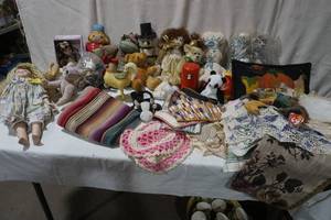 Lot of Doilies, Hot Pads, wash cloths, and a variety of vintage stuffed animals and more.
