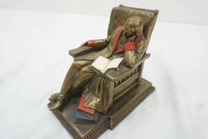K & O Company cast iron figure man sitting in a chair