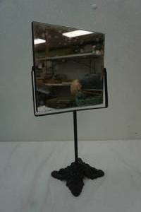 Mirror on cast iron stand