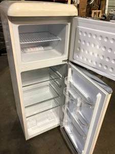 lot 50 image: Frigidaire 7.5 cu. ft. Mini Fridge in Cream with Rounded Corners and Top Freezer  Customer Returns See Pictures