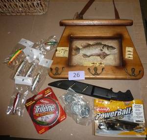 Group of fishing lures, knife, string, bait and fishing decor
