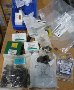 Bin with hundreds of washers, hex nuts, cap screws
