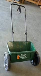Lawn fertilizer and seed spreader