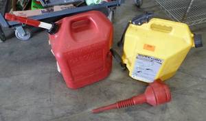 Two 5 gallon gasdiesel cans and a funnel